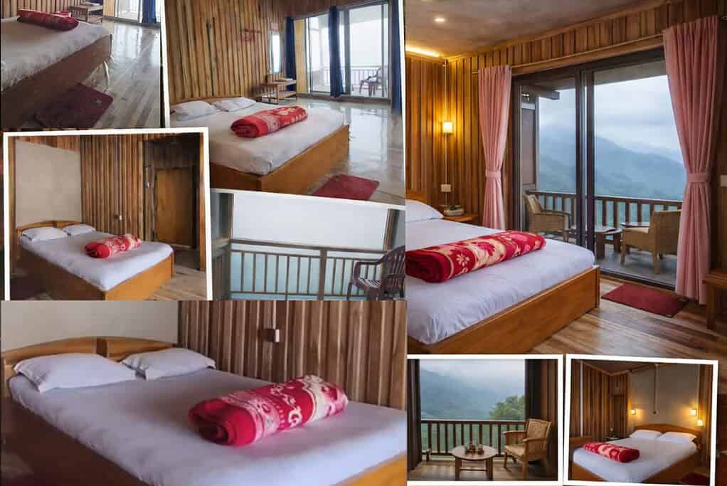 Comfortable wooden interior bedroom with balcony overlooking lush mountains.